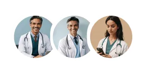 Three medical professionals wearing white coats and stethoscopes, two men smiling and one woman looking at a mobile device.