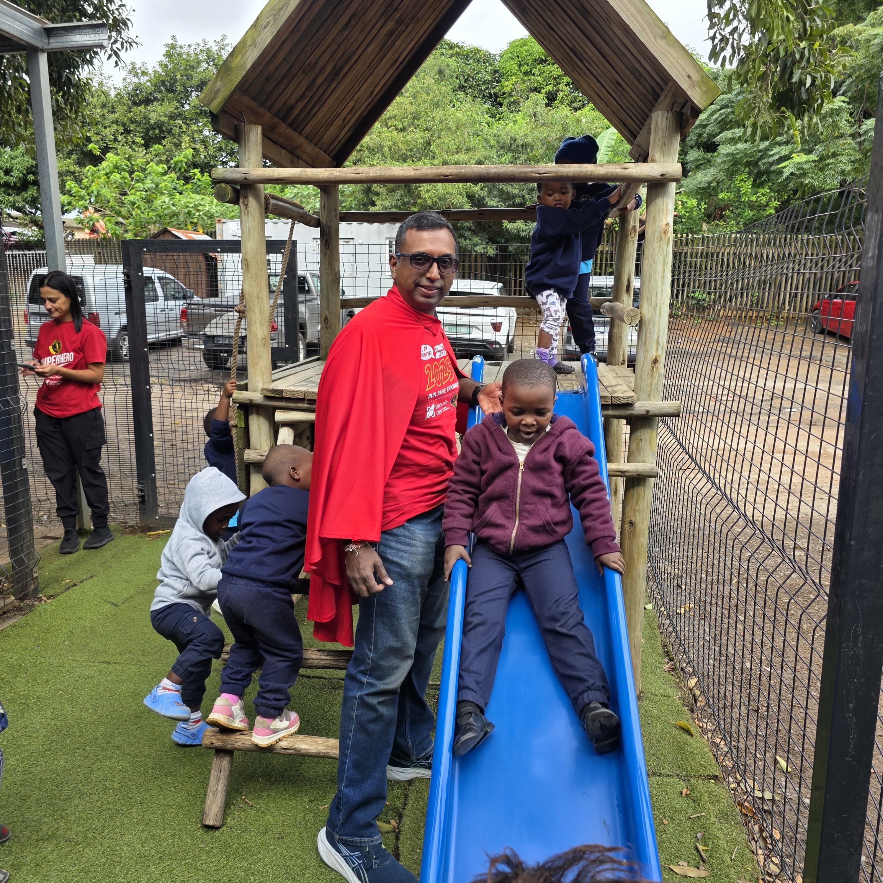 Our Superhero Runner, Mahesh Rantanjee, with some of our little beneficiaries 