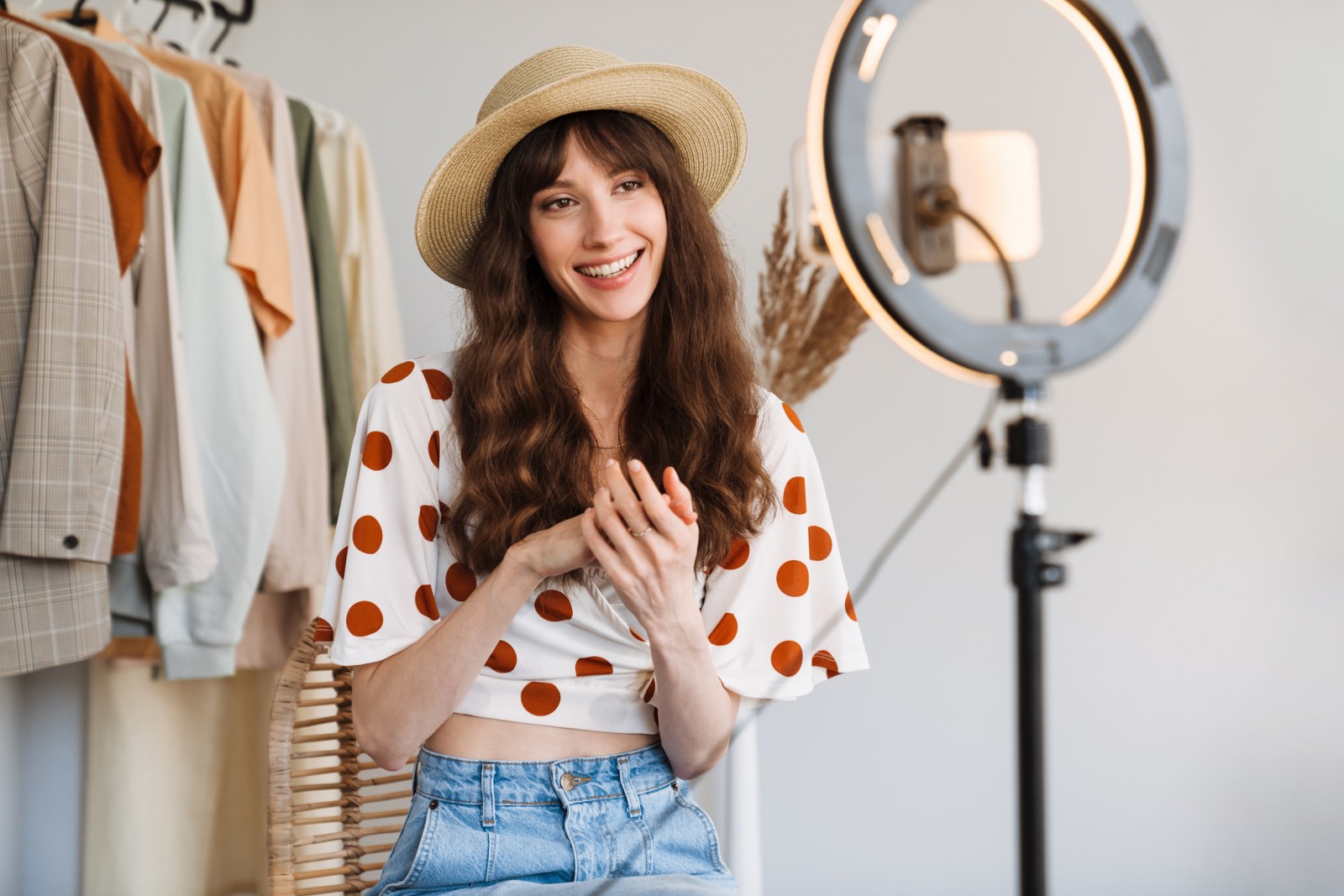 A fashion influencer making a video.