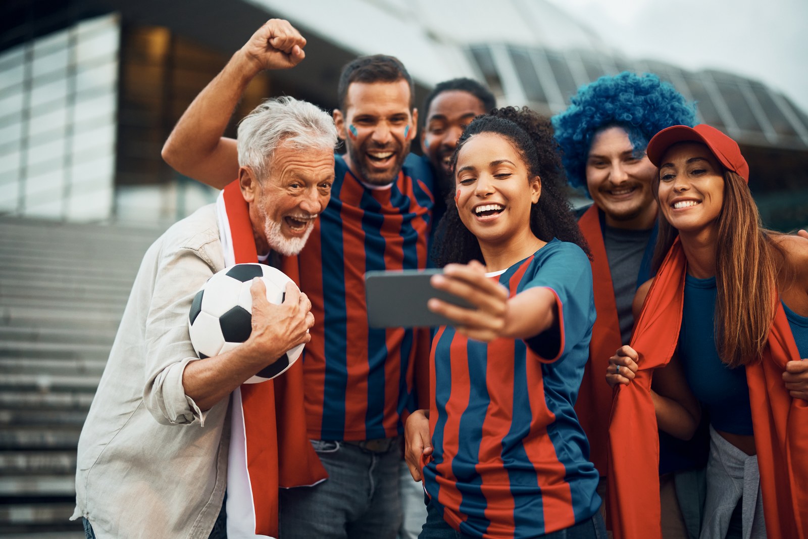 A group of football fans of different ages.