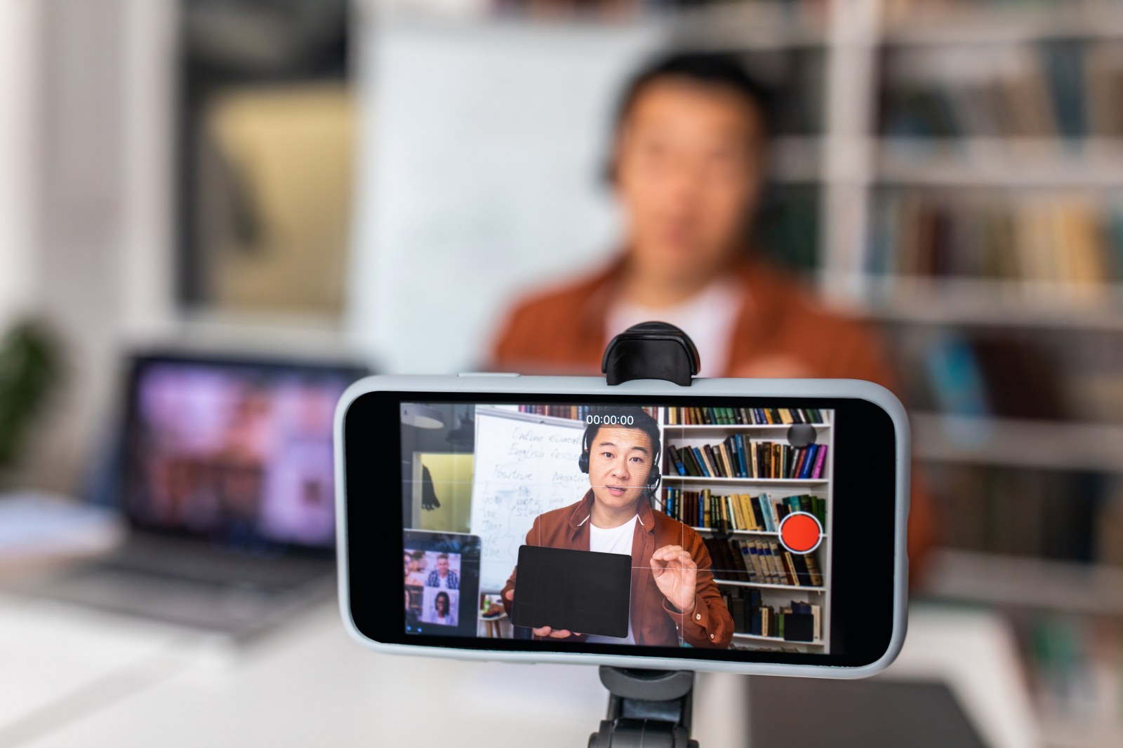 A person filming a live video.