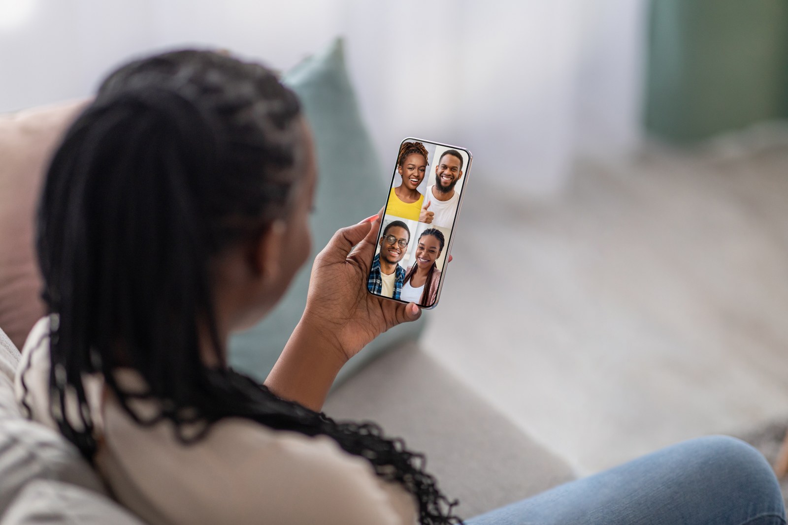 A person interacting with people on her phone.