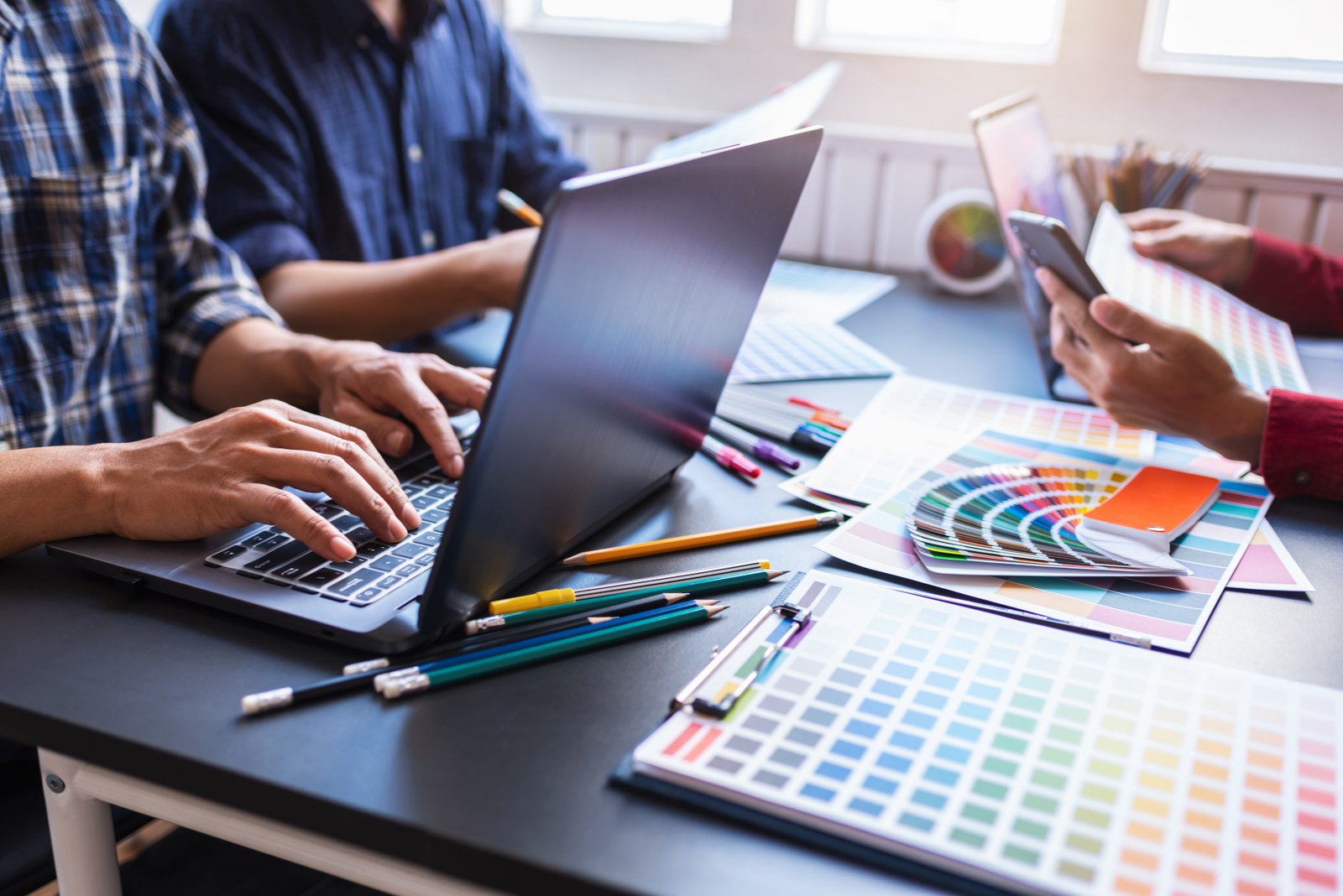 A group of people working on a website.