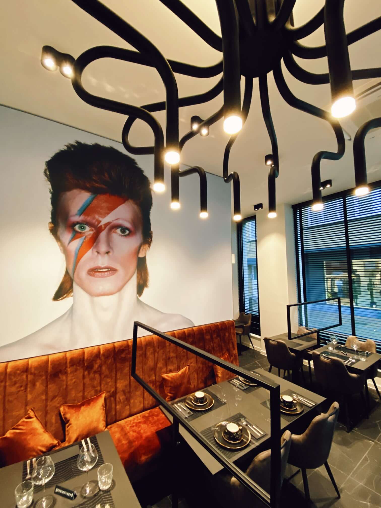 Interior of Restaurant with large picture of David Bowie