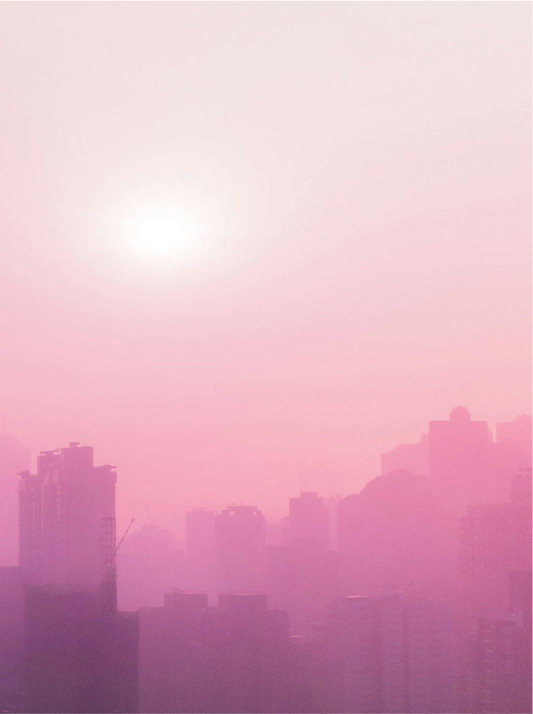 City skyline at sunrise with a pink hue, representing the future of real estate tokenization