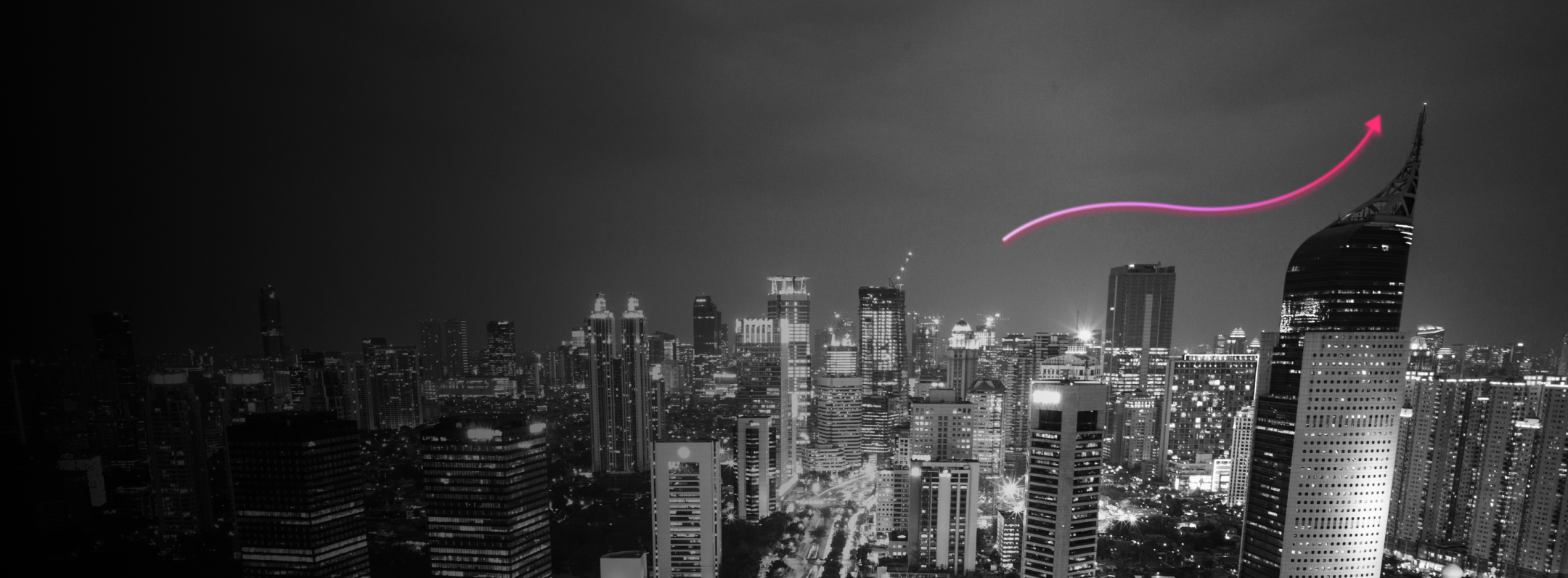 City skyline at night with a pink upward arrow, symbolizing growth and innovation in real estate tokenization.