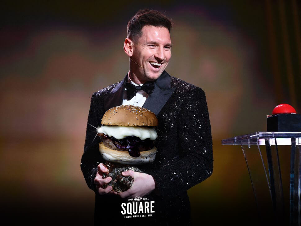 Fotomontaggio Lionel Messi con panino d'oro