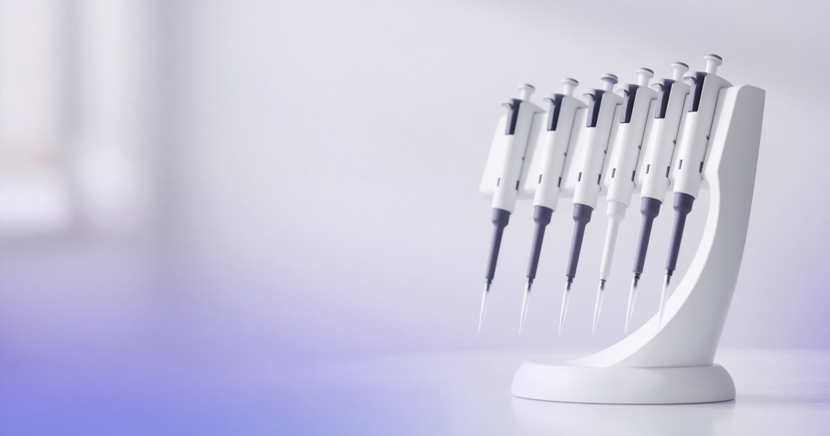 Curved carousel stand holding adjustable pipettes of different sizes, representing software that adapts to scientists