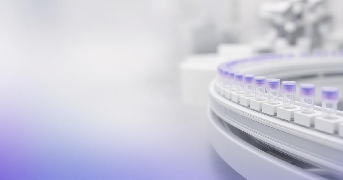 Automated lab conveyor track carrying sample tubes, representing workflow automation at scale