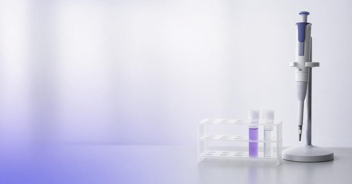Positive and negative control tubes beside a pipette on a calibration stand, representing accurate molecular testing