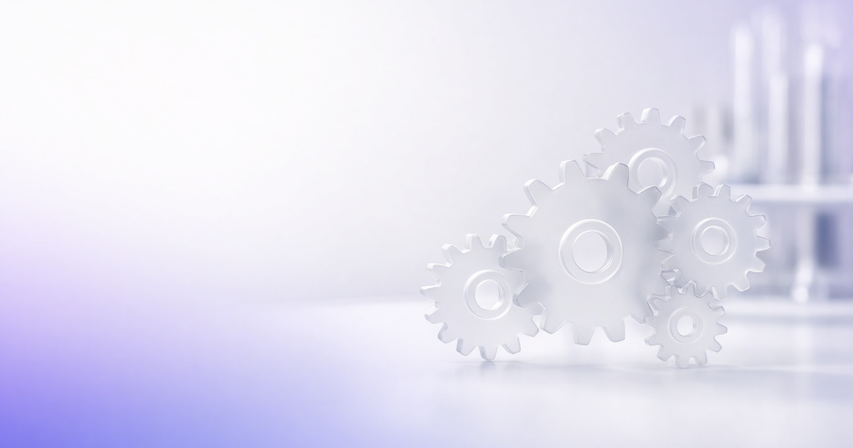 Frosted glass gears meshing on a bench, representing improved lab operations