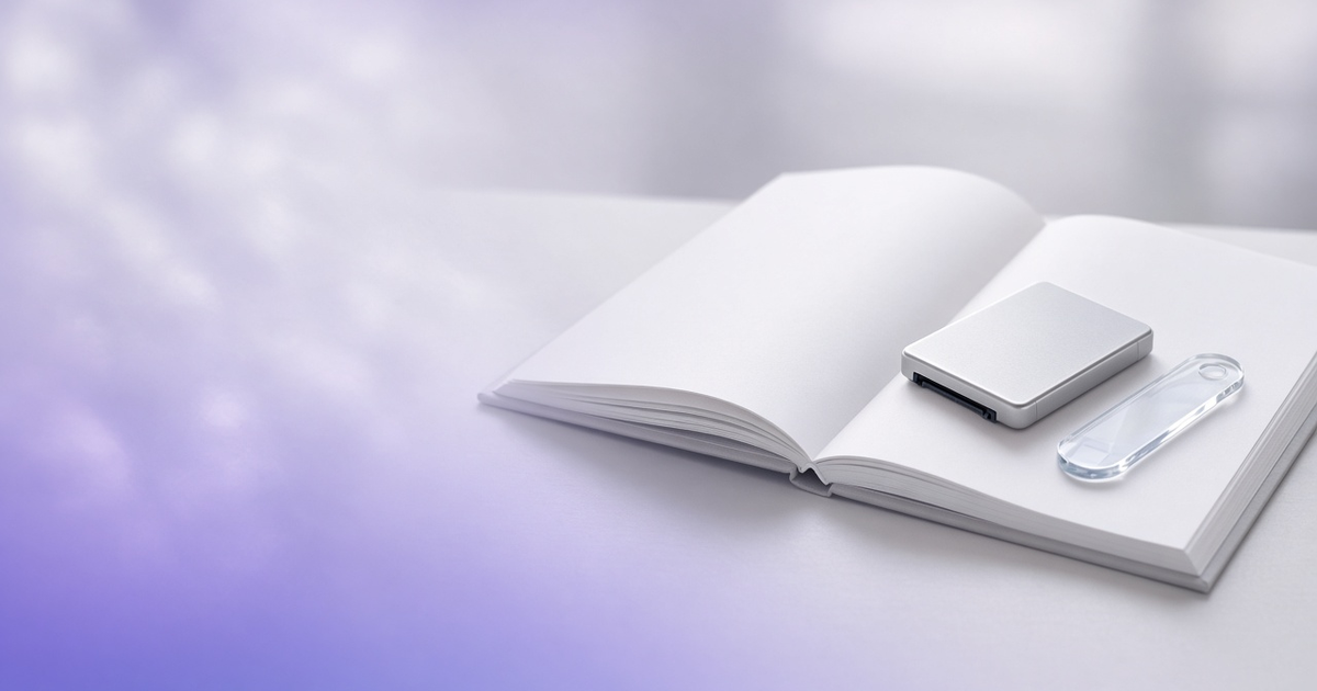 Data drive resting on a blank reference book, representing SDMS definitions