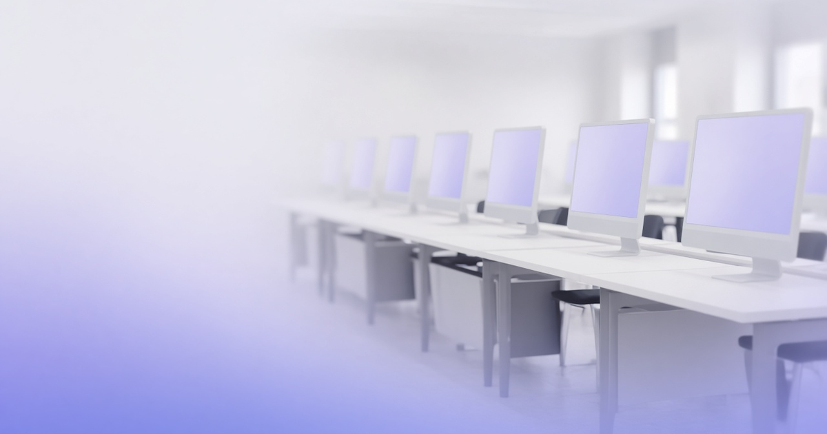 Rows of desktop monitors in a computer lab, representing computer lab management software