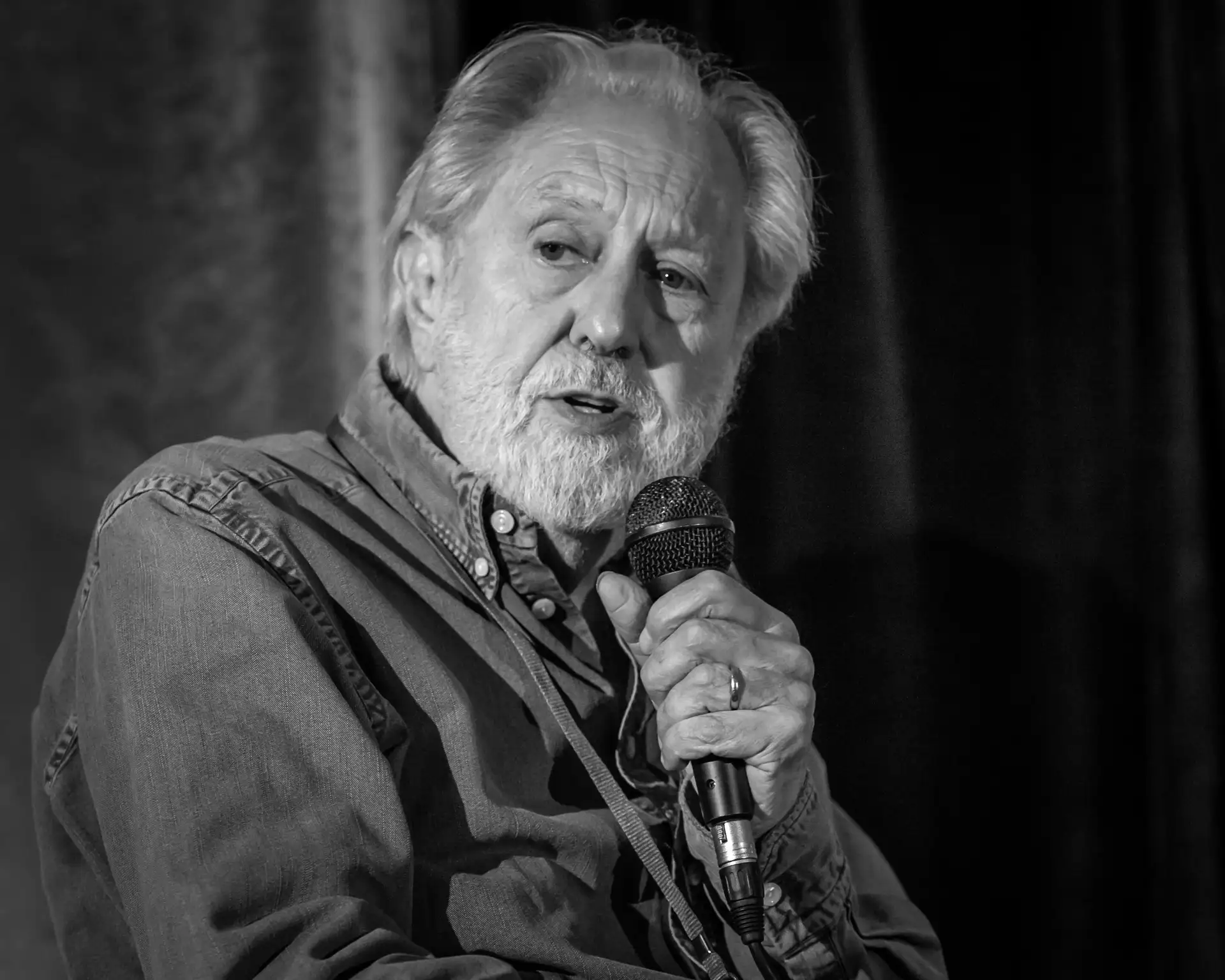 David Puttnam speaking in microphone