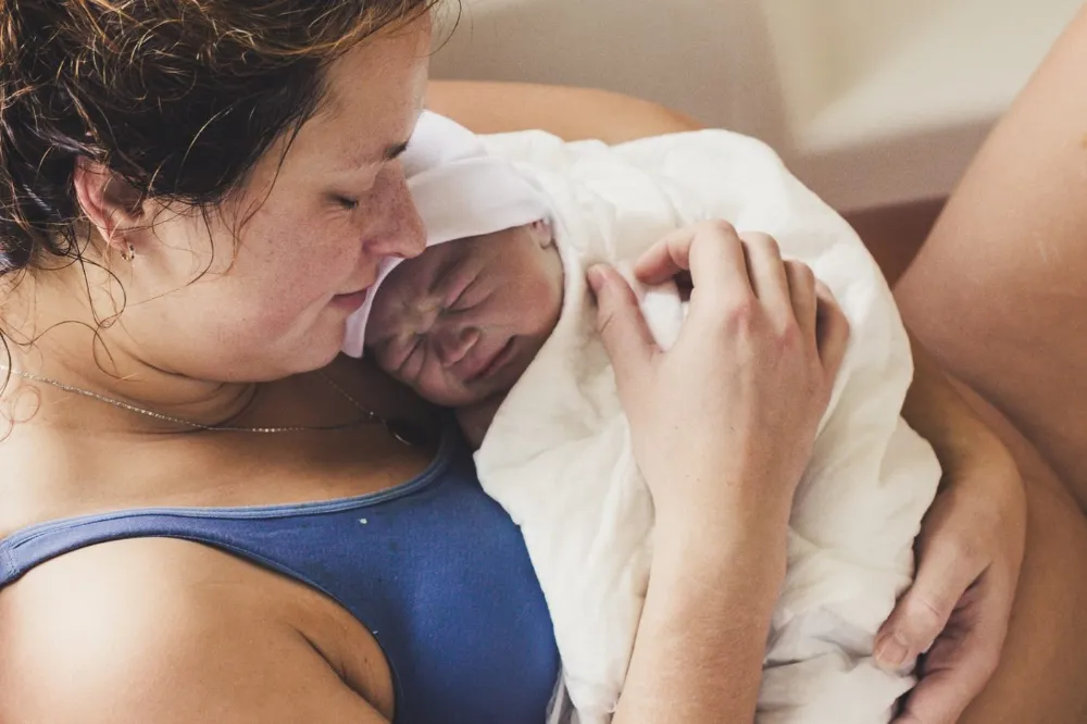 Mother holding her newborn baby