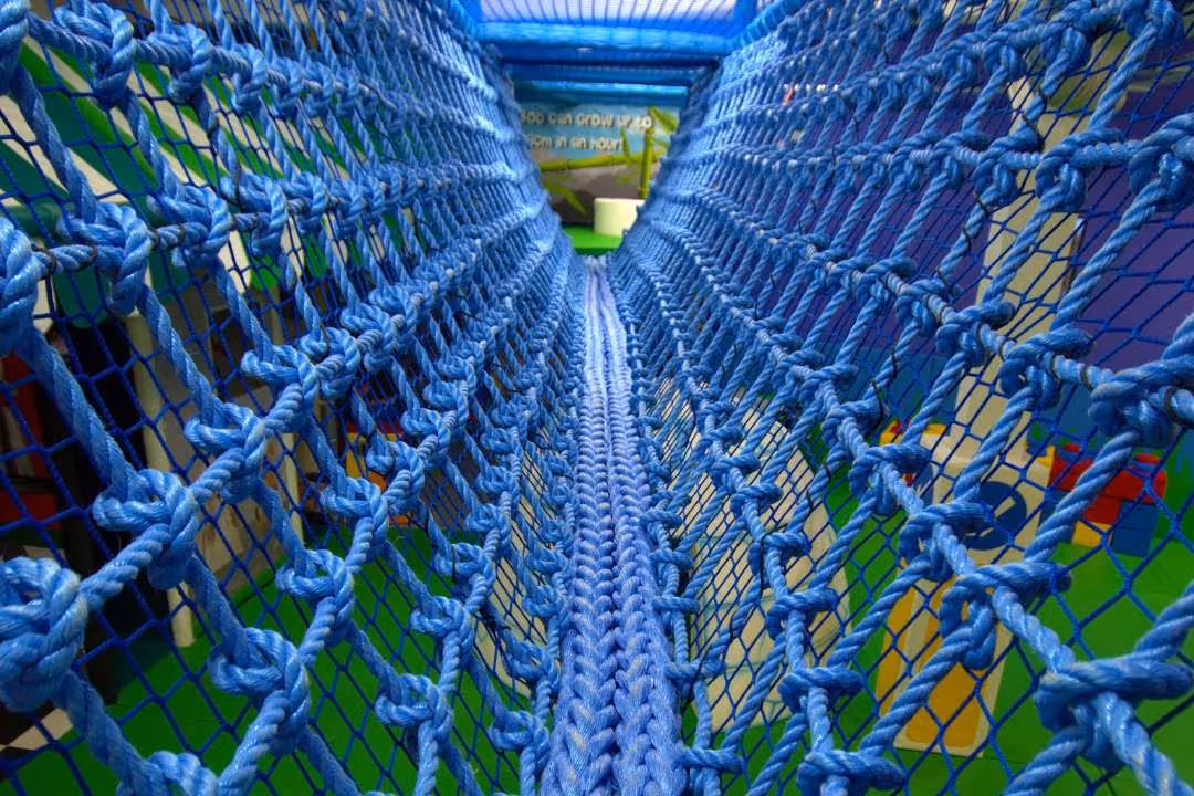 Exercise in disguise as play, rope bridge in Bubbles World of Play - indoor play barn in Wirral
