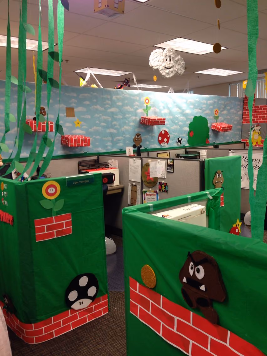 Cubicles in an office decorated like a level from the video game Mario Bros.