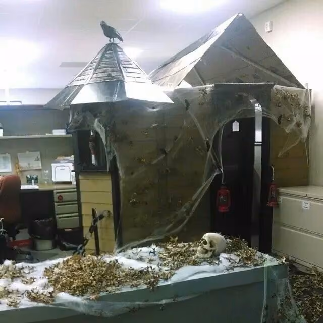 An office cubicle decorated to look like a haunted house.