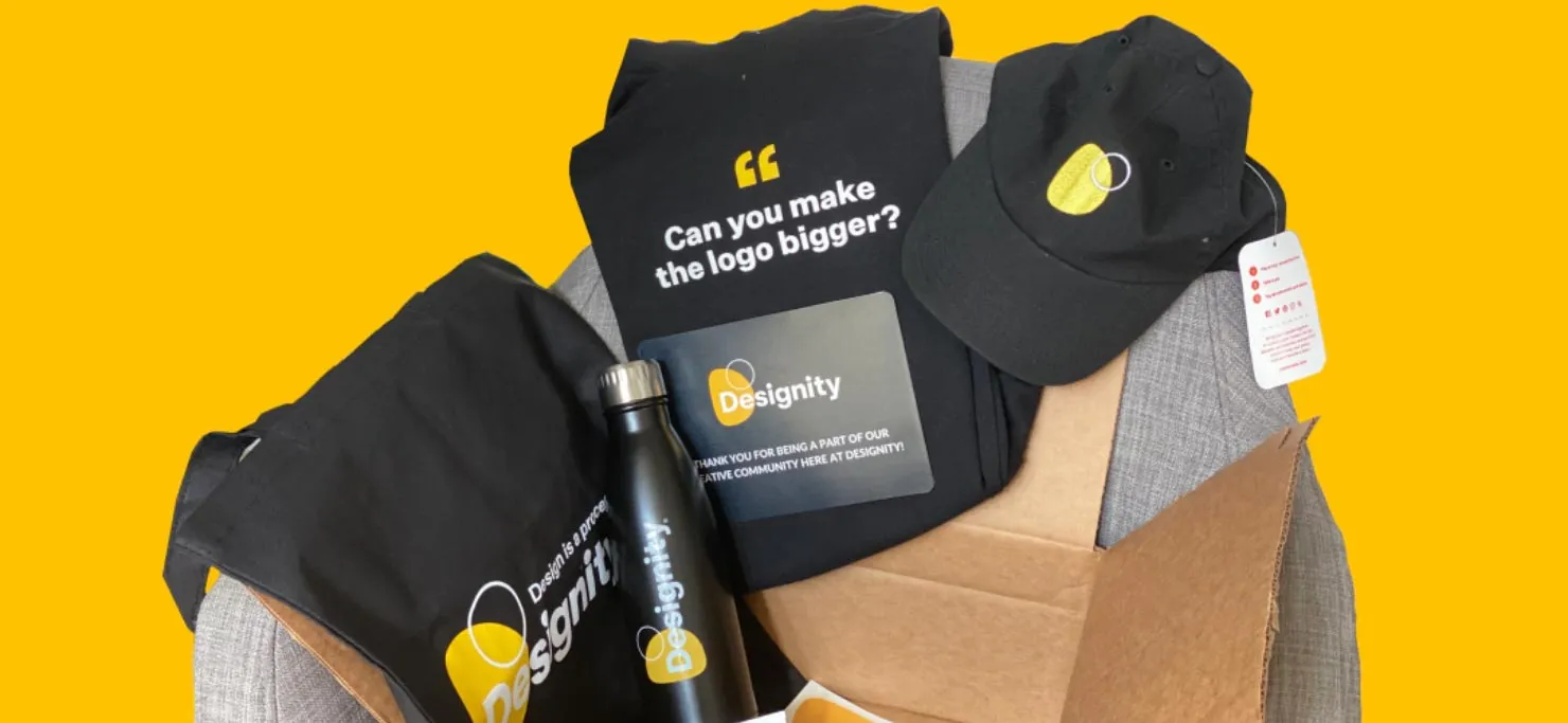 Some Designity merchandise, including a cool cap, a T-shirt, and a water bottle.