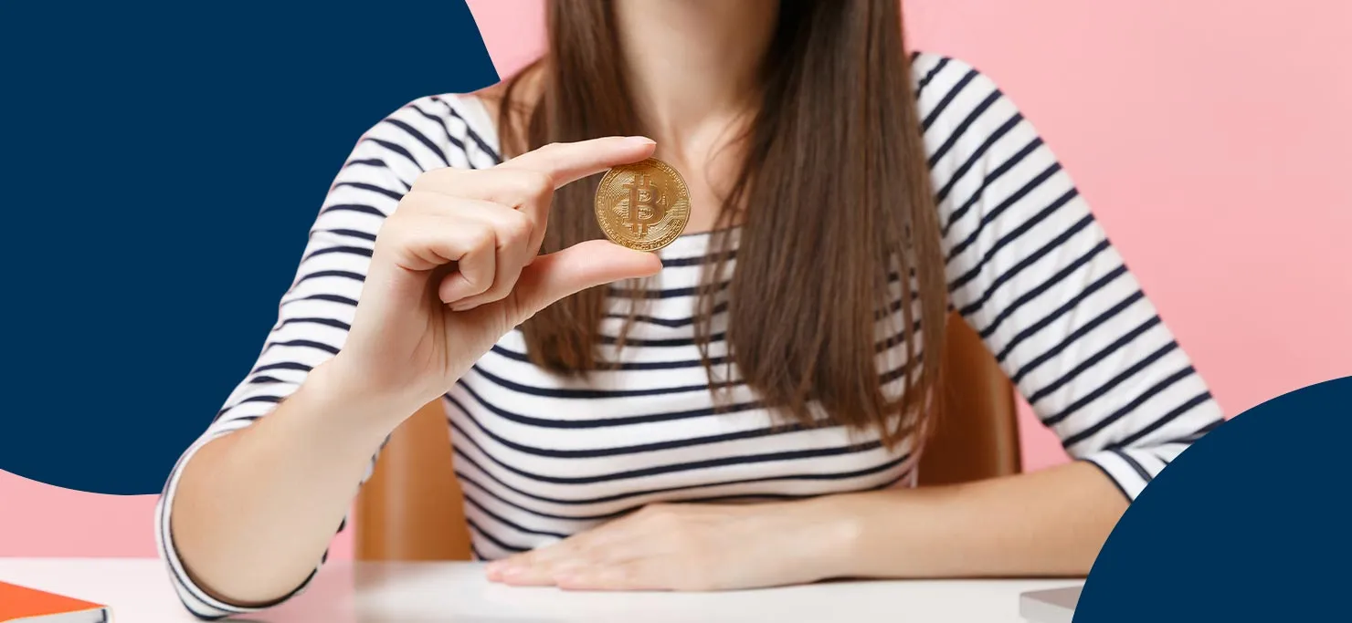 A woman in a black and white striped shirt. She is holding up a gold coin for the camera. Set against a navy and pink Designity background.