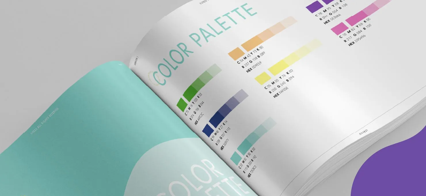 A brand book open to a page on color palettes.