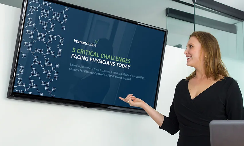 Photo of a woman pointing at a screenshot from a presentation deck created by Designity for Immuno Labs.