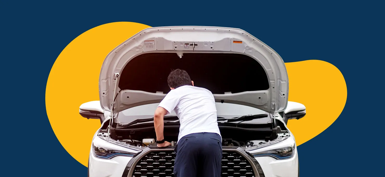 A man checks the engine of a sports car.