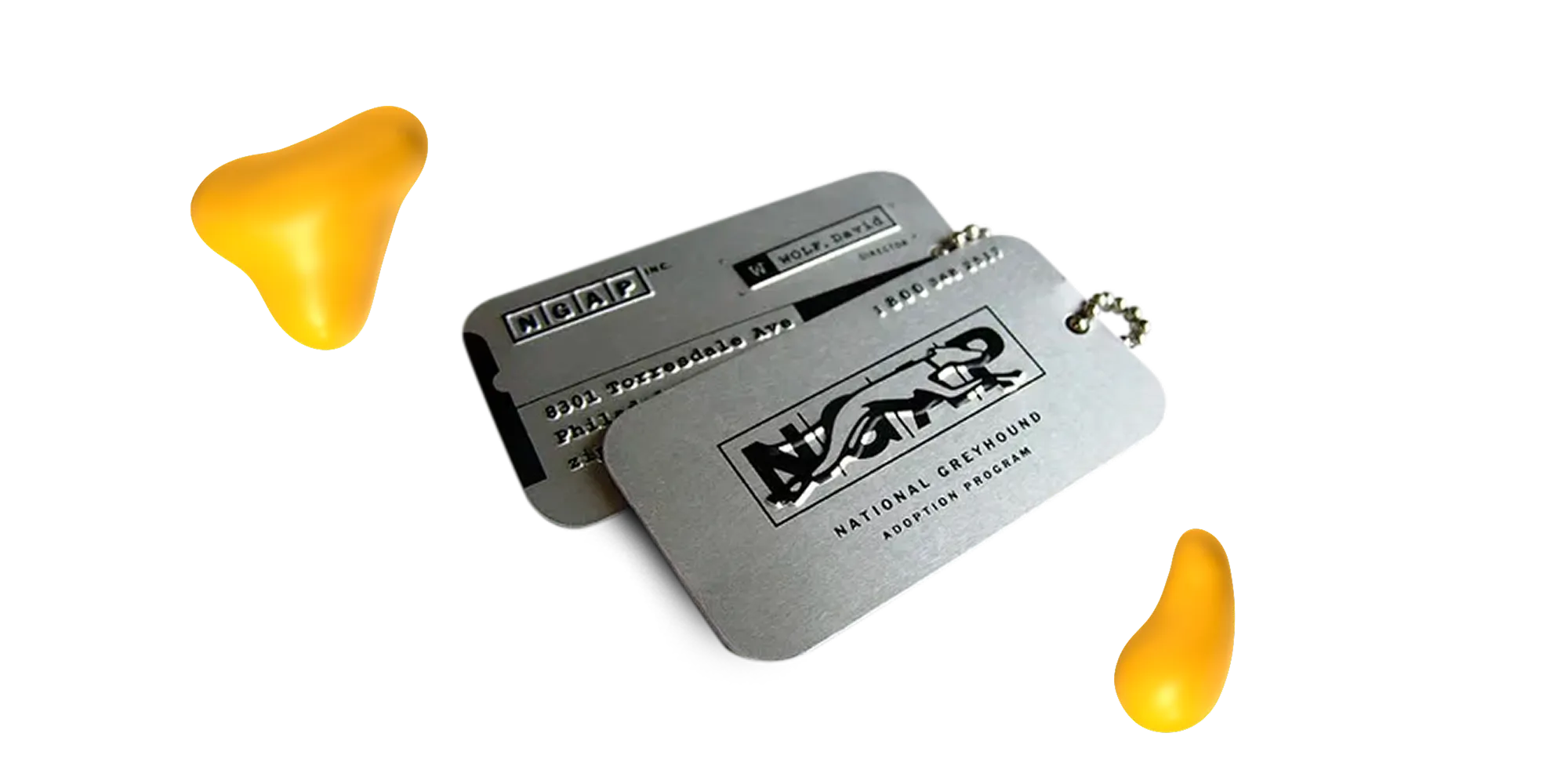 Sleek metallic business cards with engraved logo and text on a silver finish.