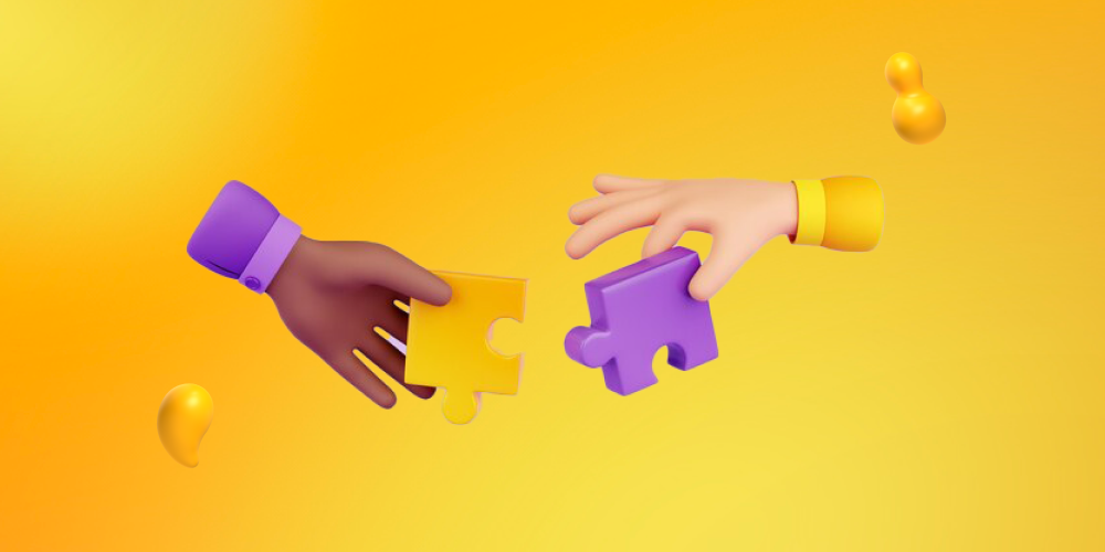 Two hands joining the pieces of a puzzle. AI and humans are better together!