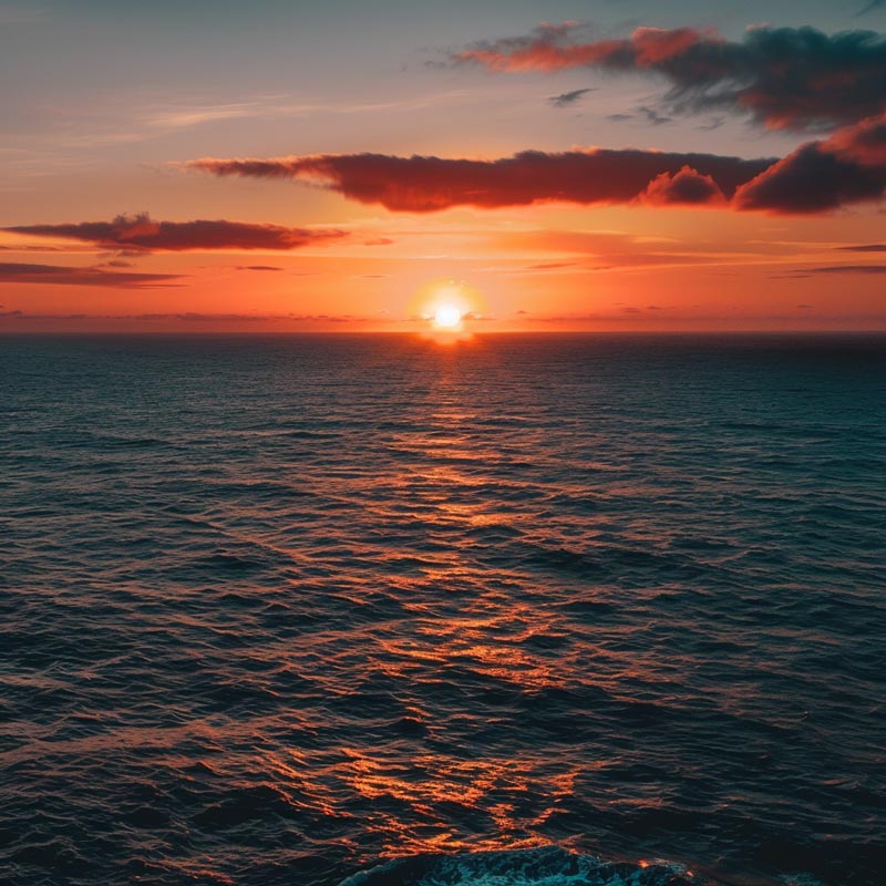 A Midjourney image created by using the prompt, "A sunset over the ocean, DSLR camera, 50mm lens, 16:9 aspect ratio, 4K resolution."