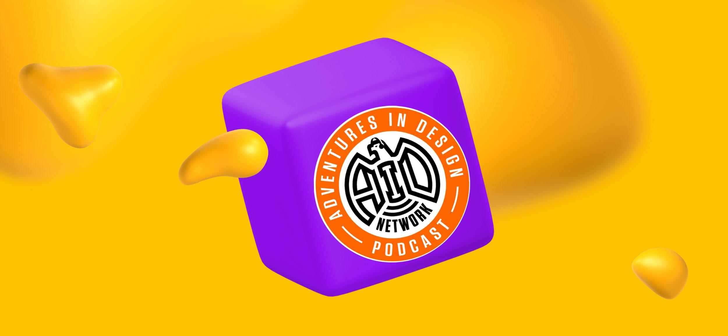 A purple cube with Adventures in Design's logo.