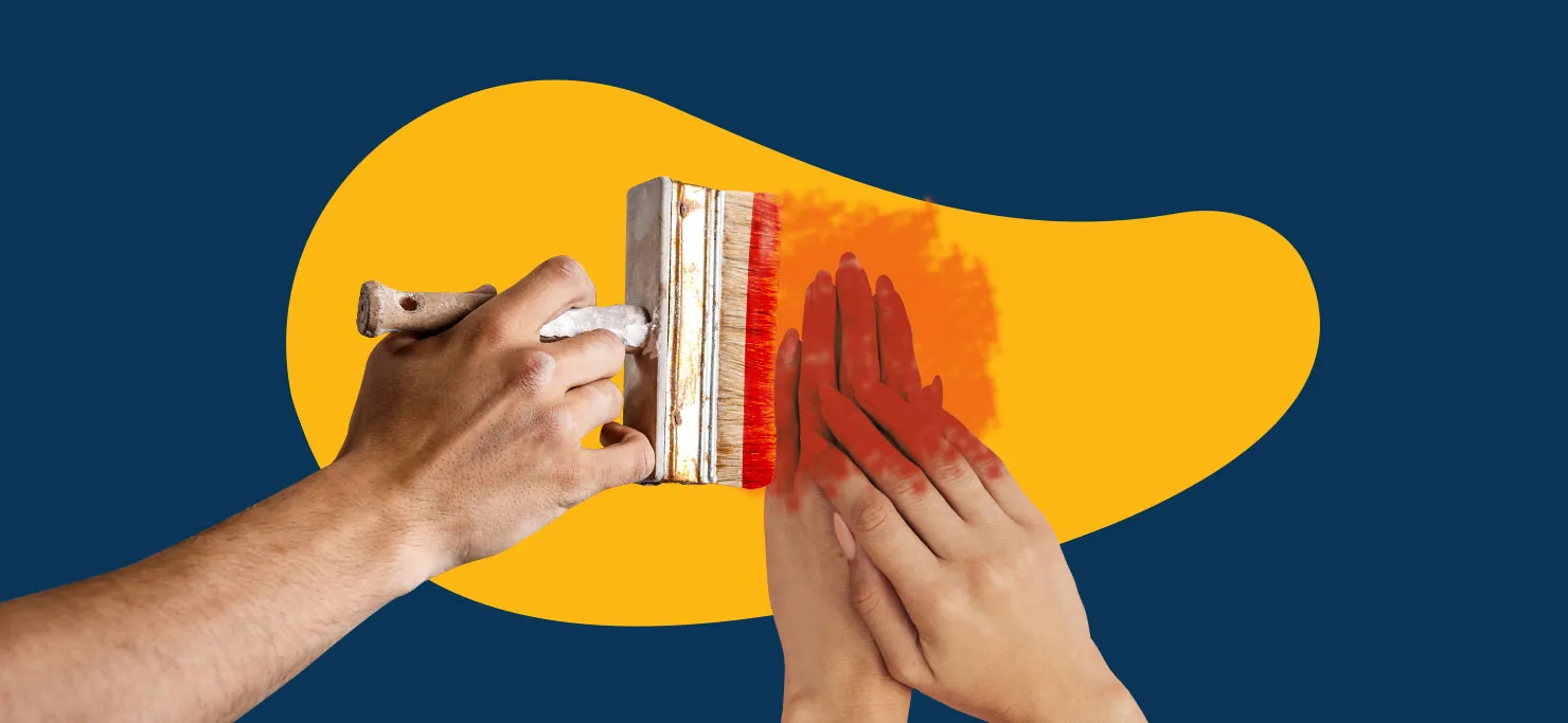 Someone paints over a woman's hands with red paint. The hands and paintbrush are against a yellow Designity blob background.
