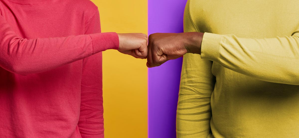 Two freelancers fist bumping
