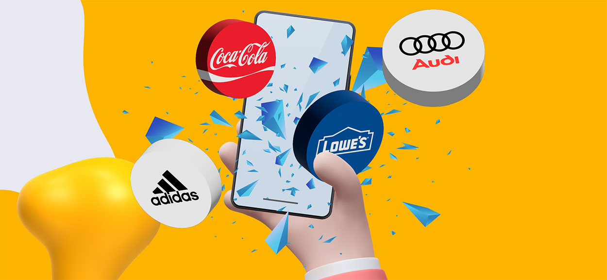 A smartphone with logos for Coca Cola, Audi, Adidas, and Lowe's bursting through its glass..