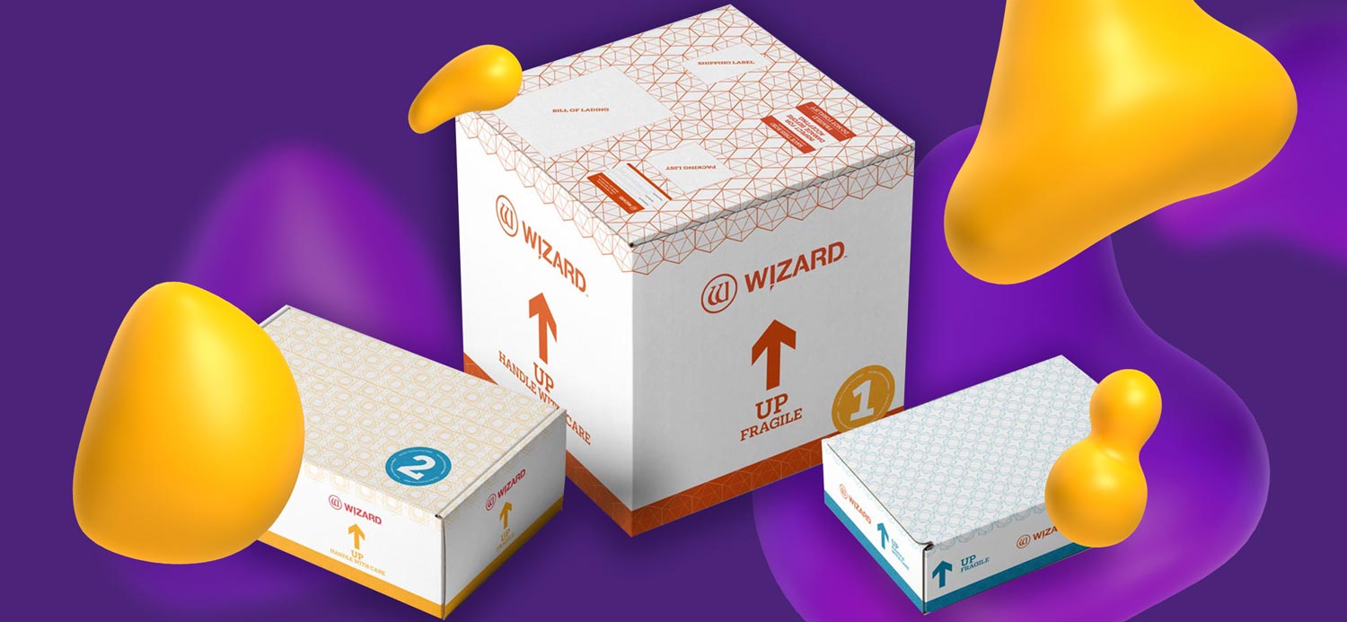 Wizard brand mat cutter packaging. It is simple and clean with orange, yellow, or blue geometric patterns on top and orange lettering.
