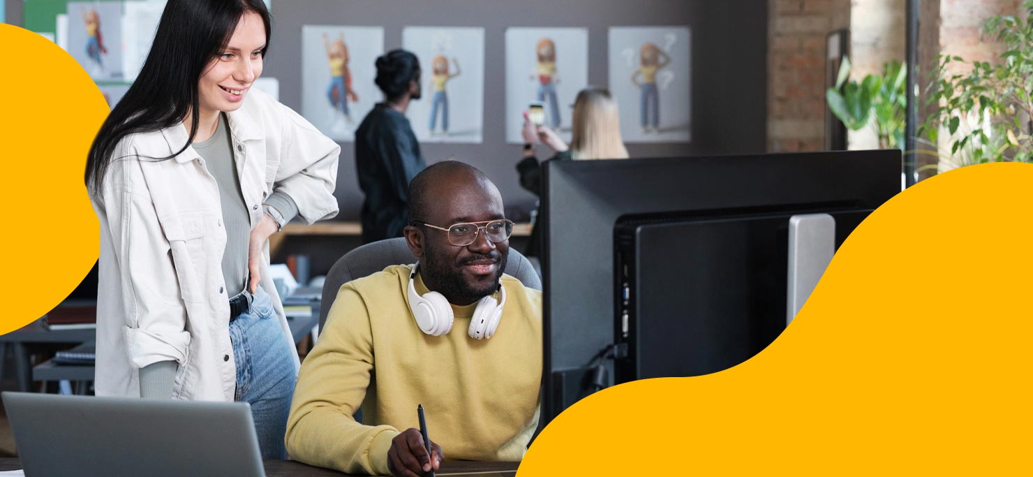 A man and a woman look at a computer screen, searching for a freelancer to meet their creative and marketing needs when they could go to Designity instead.