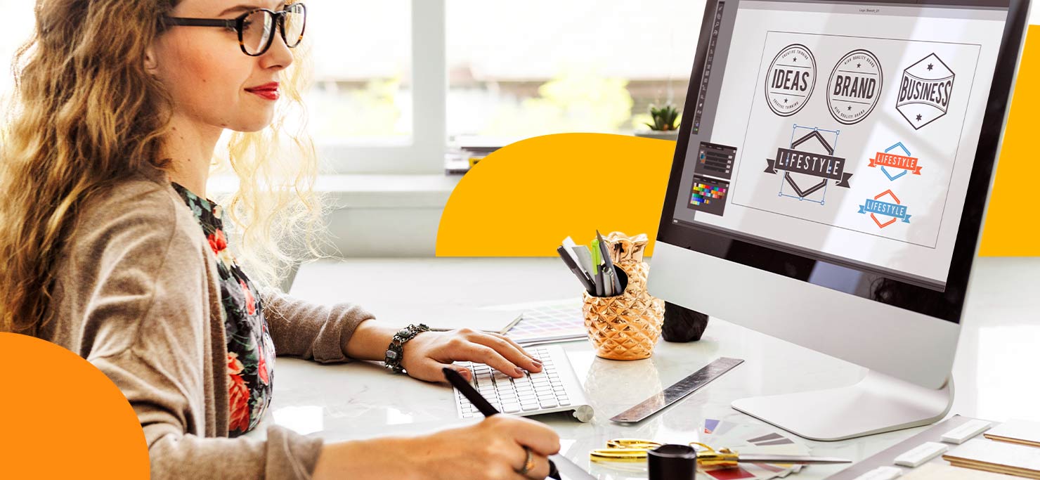 A designer going through different logo ideations on her laptop.