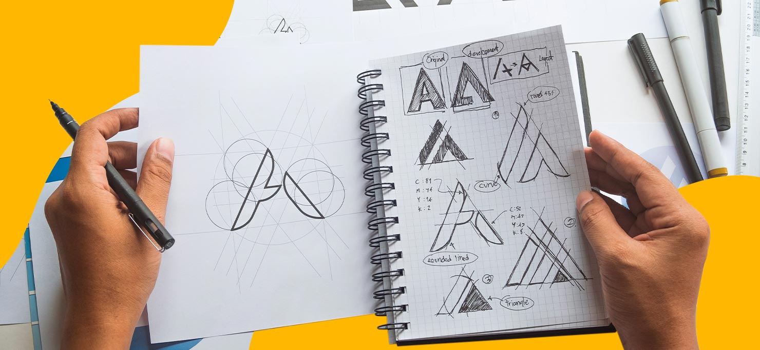 A designer's sketch book with different typography sketched out.