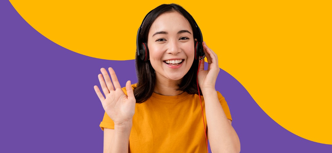 A smiling woman wearing headphones, against a Designity purple and yellow background.