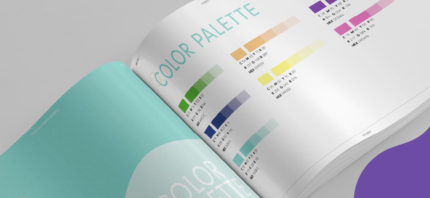 A brand book open to a page on color palettes.
