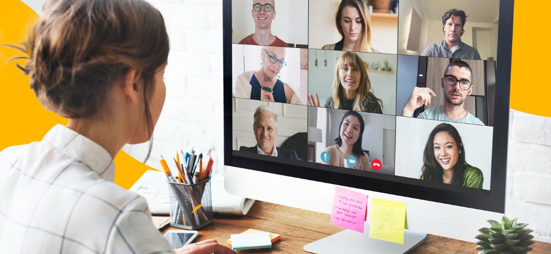 A woman sits in on a video call with 9 other coworkers.