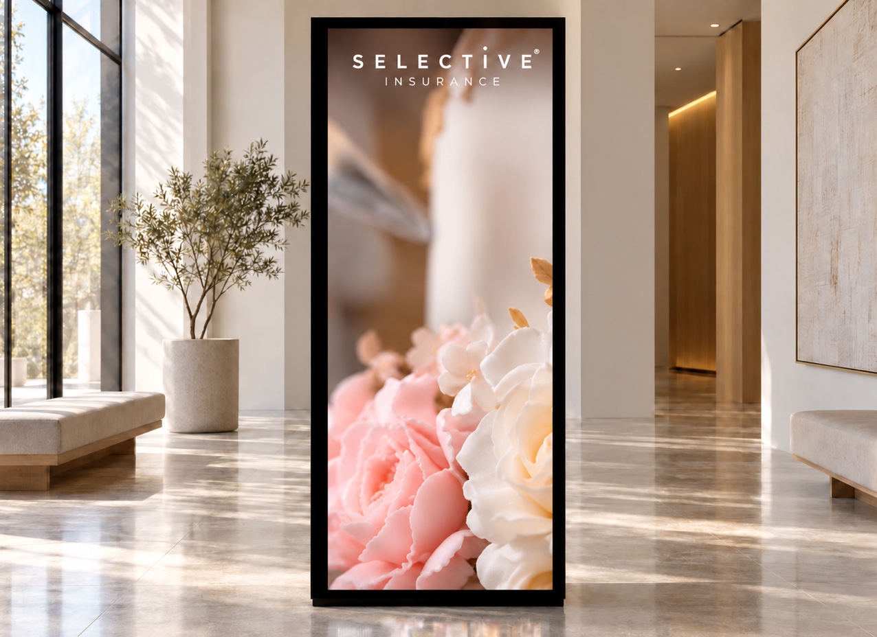 Selective Insurance’s baker banner featuring floral cake details displayed on a portrait lightbox.