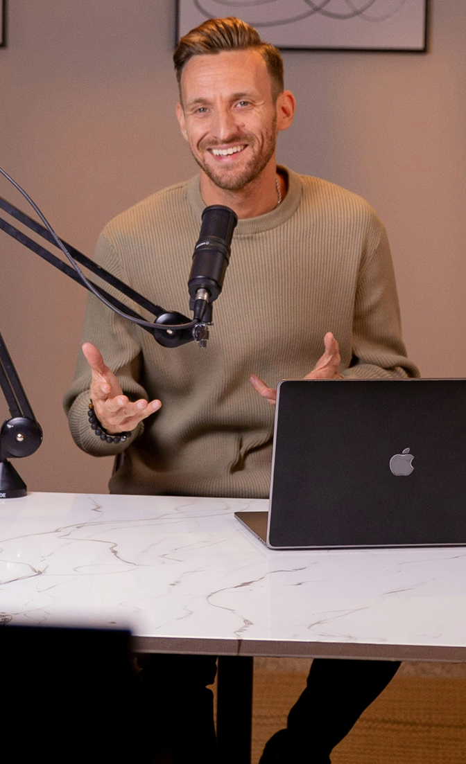 Presenter hosting a live webinar on a laptop, representing the best webinar software for 2026