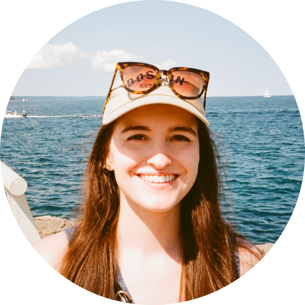 Sam smiling in front of Lake Michigan