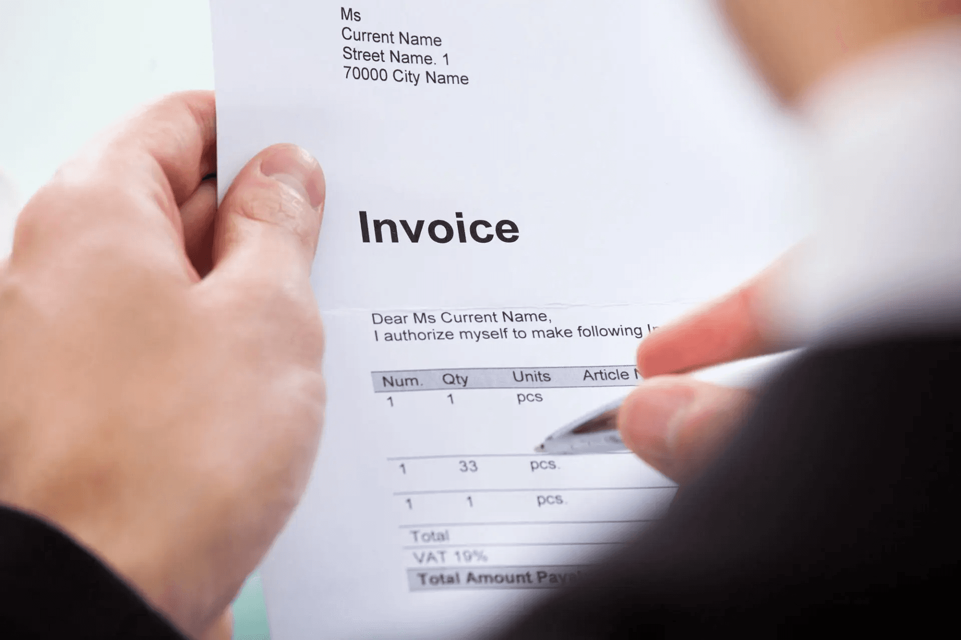  Person reviewing and signing invoice paper - Contractor Invoice