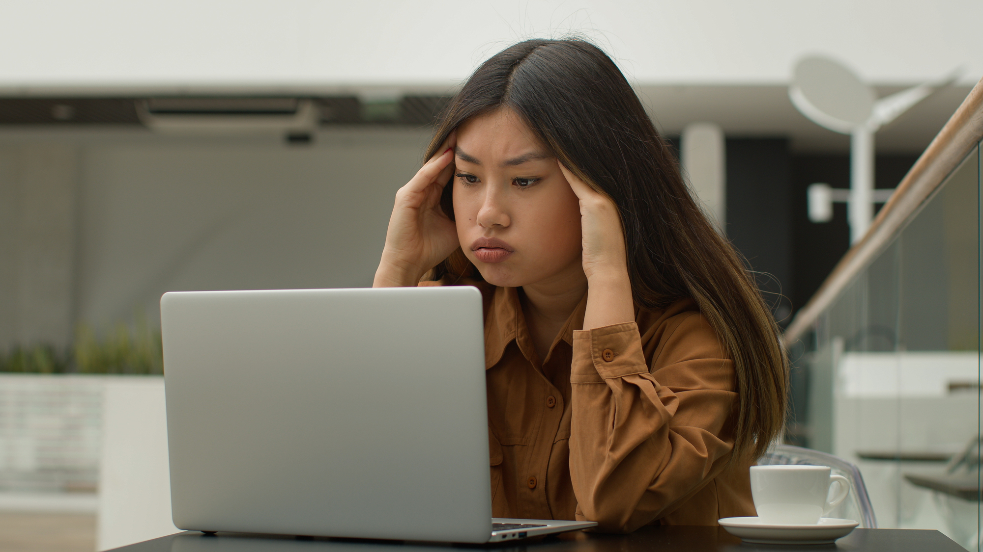 woman looking tensed - International Payroll Companies