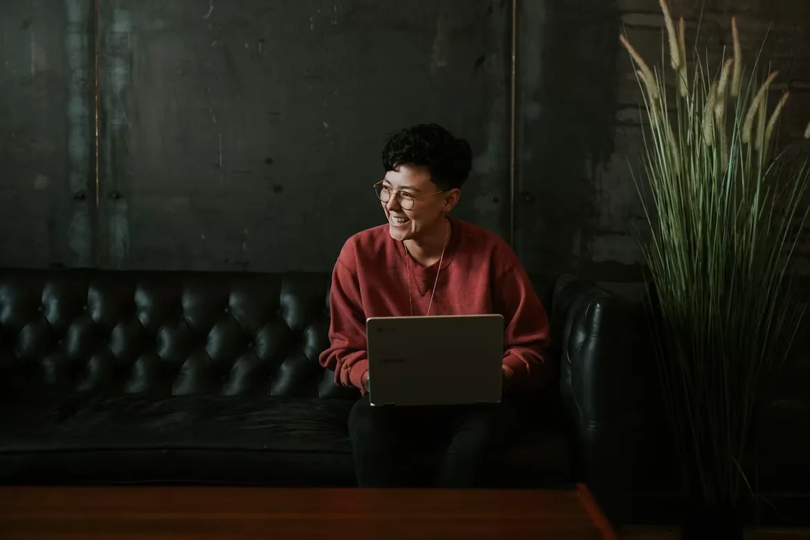 Remote contractor working on a laptop, paid on time through Ontop
