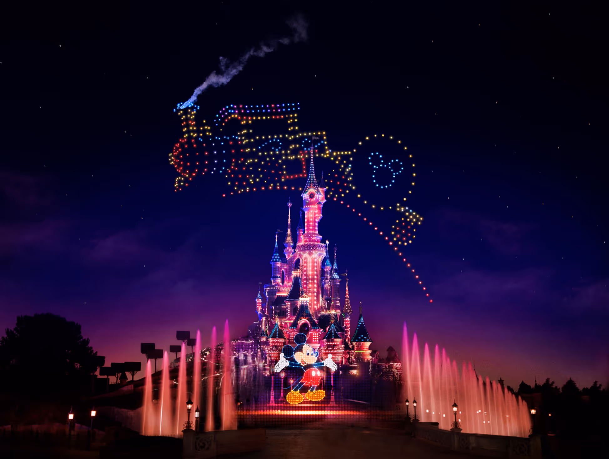 Dronisos drone light show above Disneyland Paris castle featuring a glowing train