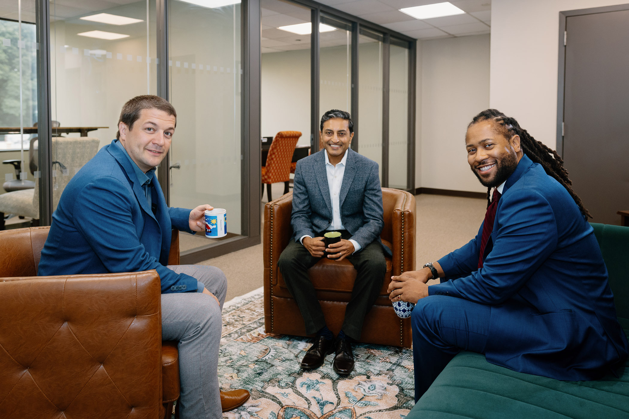 Attorneys Kyle, Yogi and Jaleel sitting at table and looking forward to to meeting with you