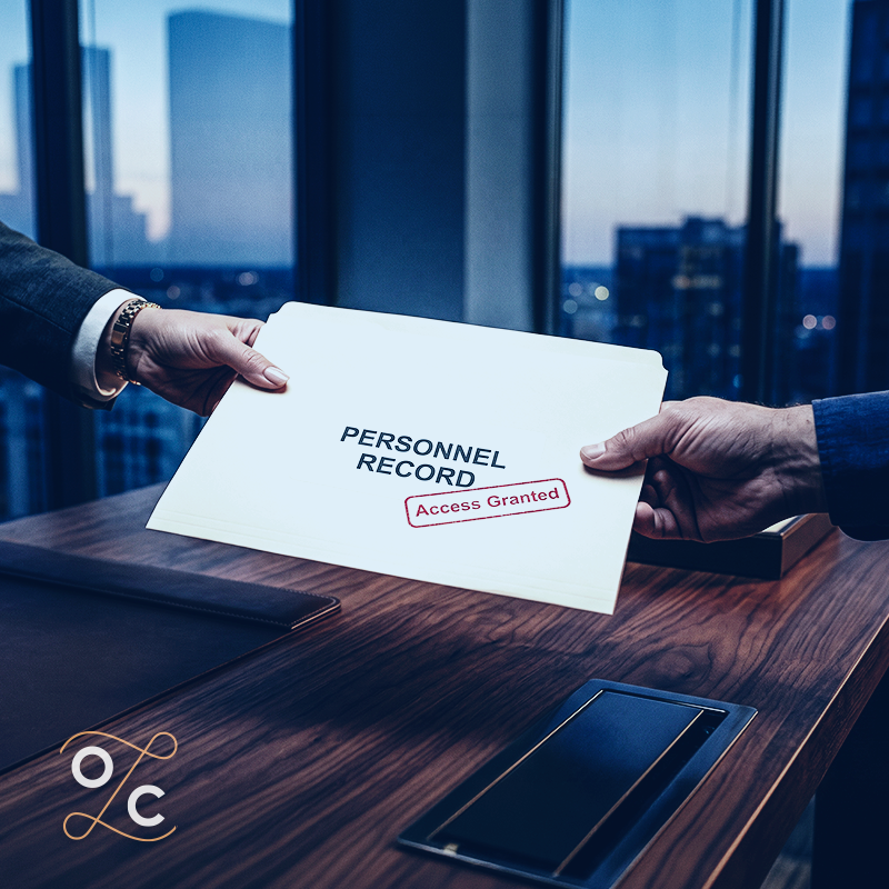 Hands exchanging a personnel record folder marked “Access Granted,” illustrating New York’s new law expanding employee access to personnel files and related documentation.